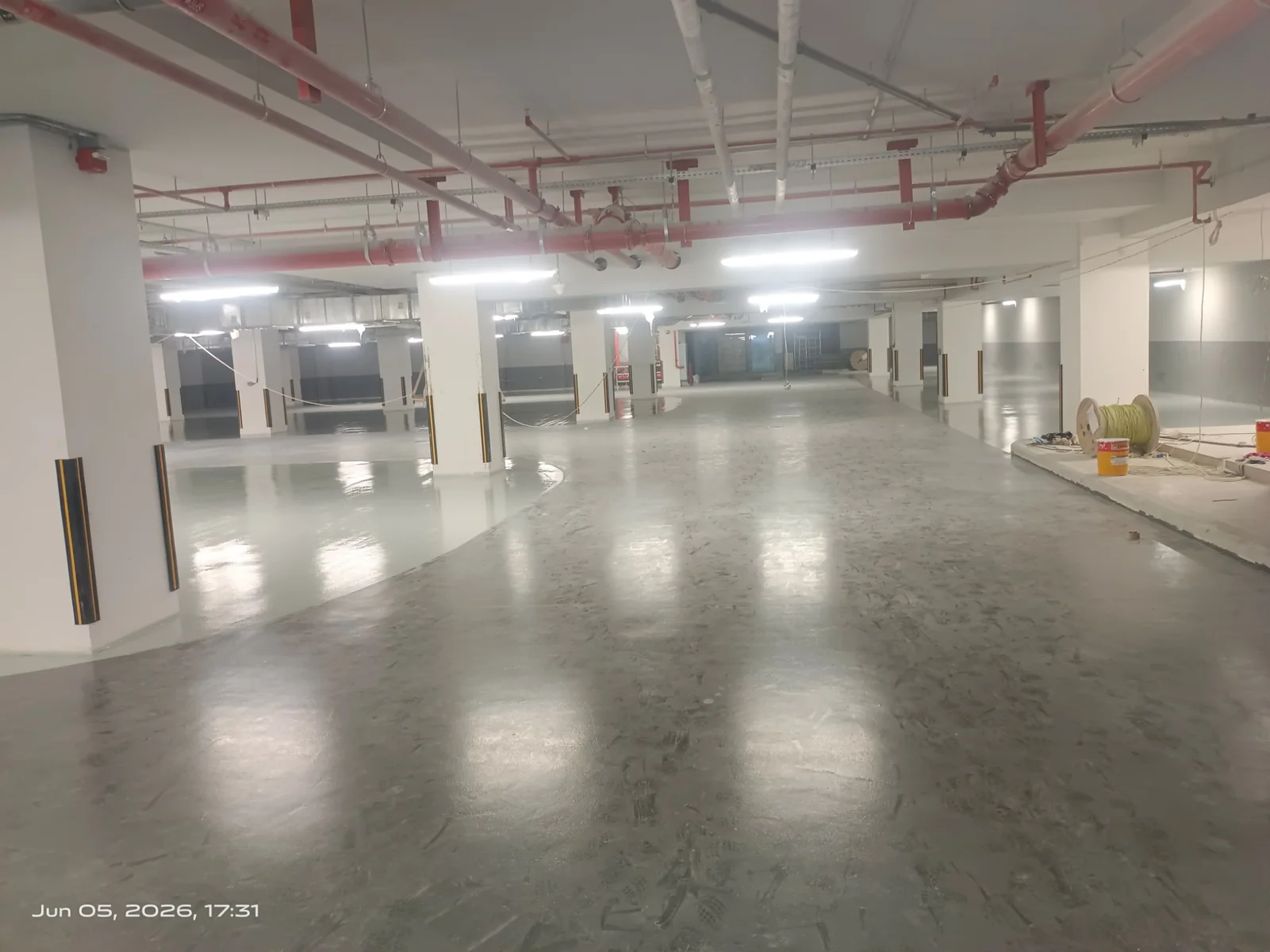 Commercial parking floor before final epoxy coating and traffic marking work